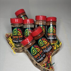 Texas Spice Custom 7 Spice Blend Gift Basket filled with shaker bottles with red lids on a white background